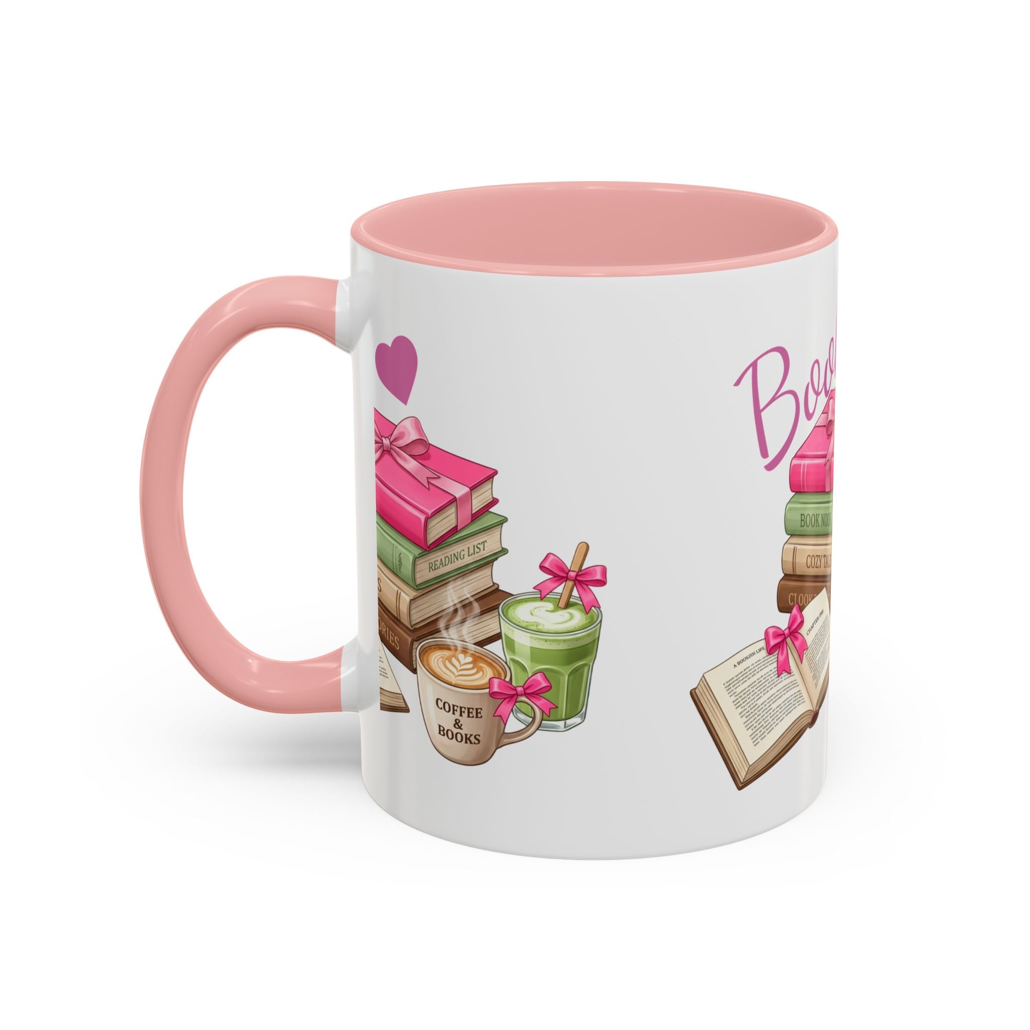 A white ceramic mug with a pink interior and handle, decorated with illustrations of books, coffee, and a green drink tied with pink ribbons, on a clean white background.
