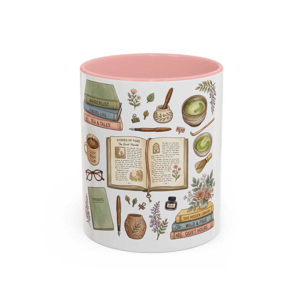 A white ceramic mug with a pink interior, decorated with vintage-style illustrated books, herbs, a mortar and pestle, a teacup, and other cozy reading-themed motifs on a white background.