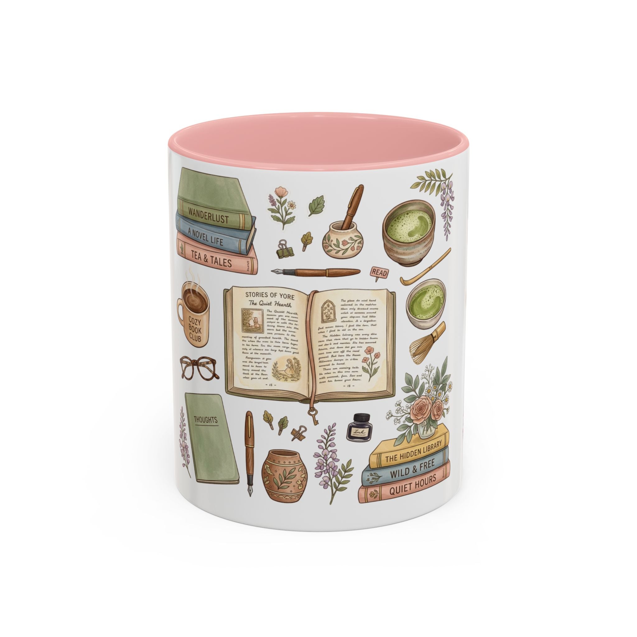 A white ceramic mug with a pink interior, decorated with vintage-style illustrated books, herbs, a mortar and pestle, a teacup, and other cozy reading-themed motifs on a white background.