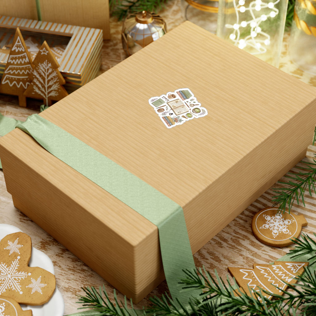 Wooden gift box with a green ribbon on a festive background with cookies and lights, with a cute bookish decal sticker.