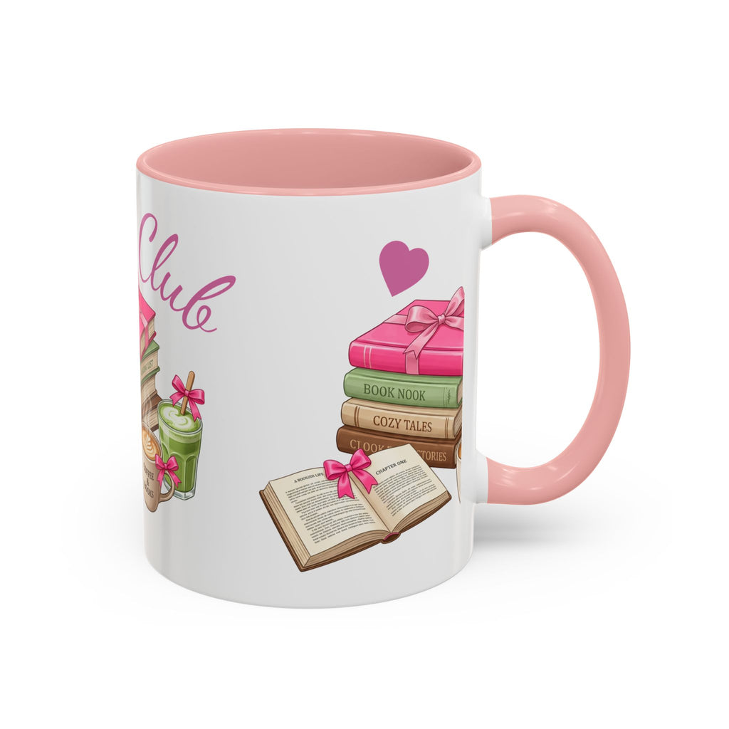 A white ceramic mug with a pink interior and handle, decorated with illustrations of books, an open book, a pink heart, and the word 'Club' in pink script.
