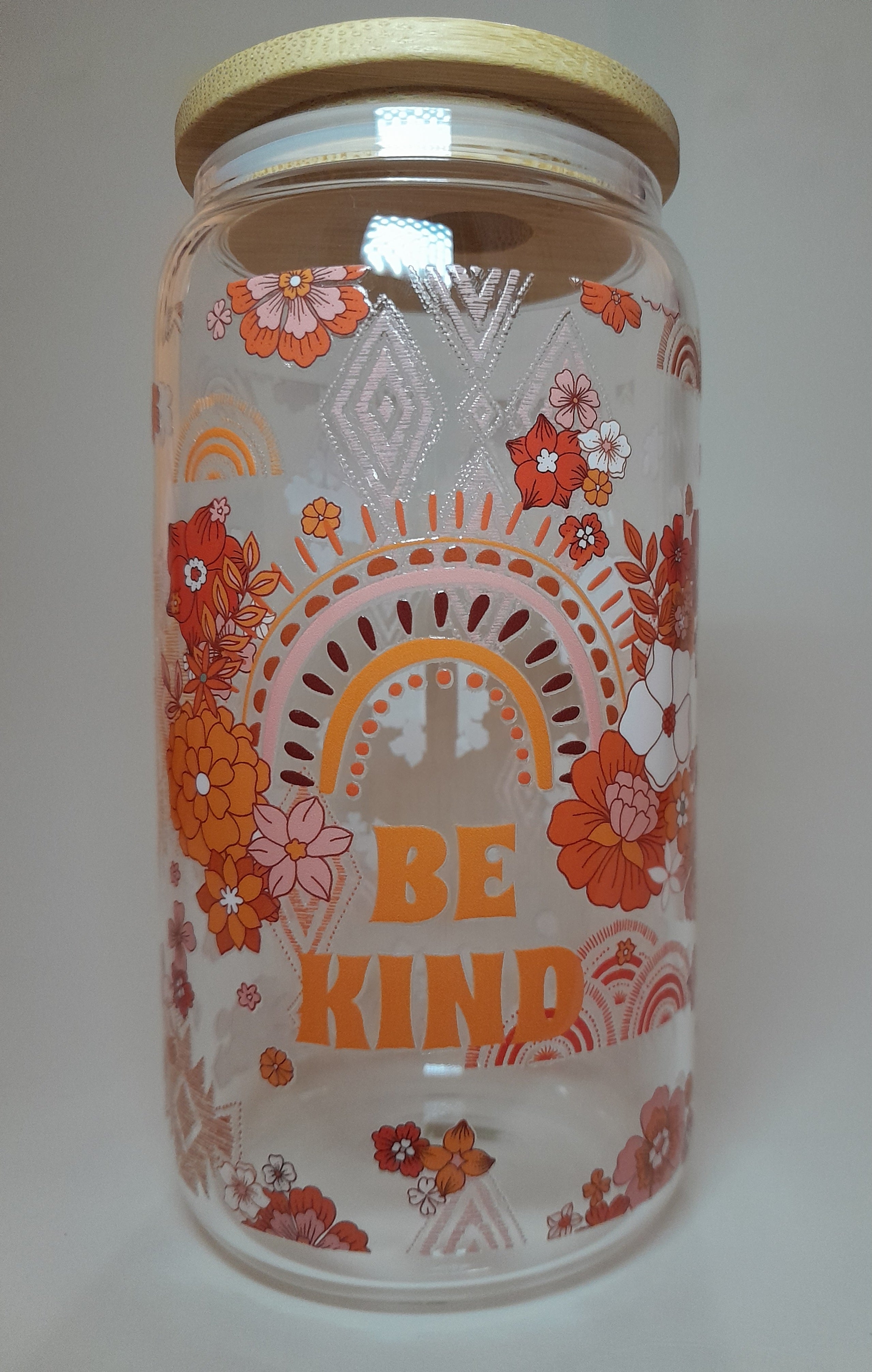 A Borosilicate glass cup with Bamboo lid and Floral design 