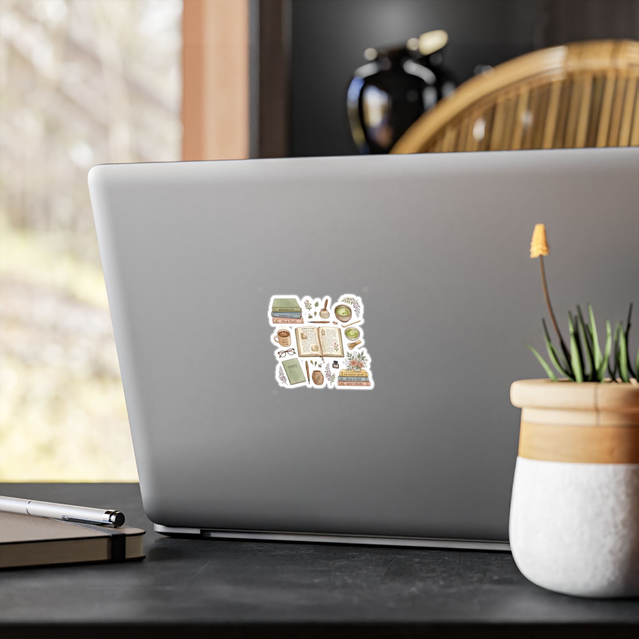 Laptop with a sticker on a desk with a blurred background
