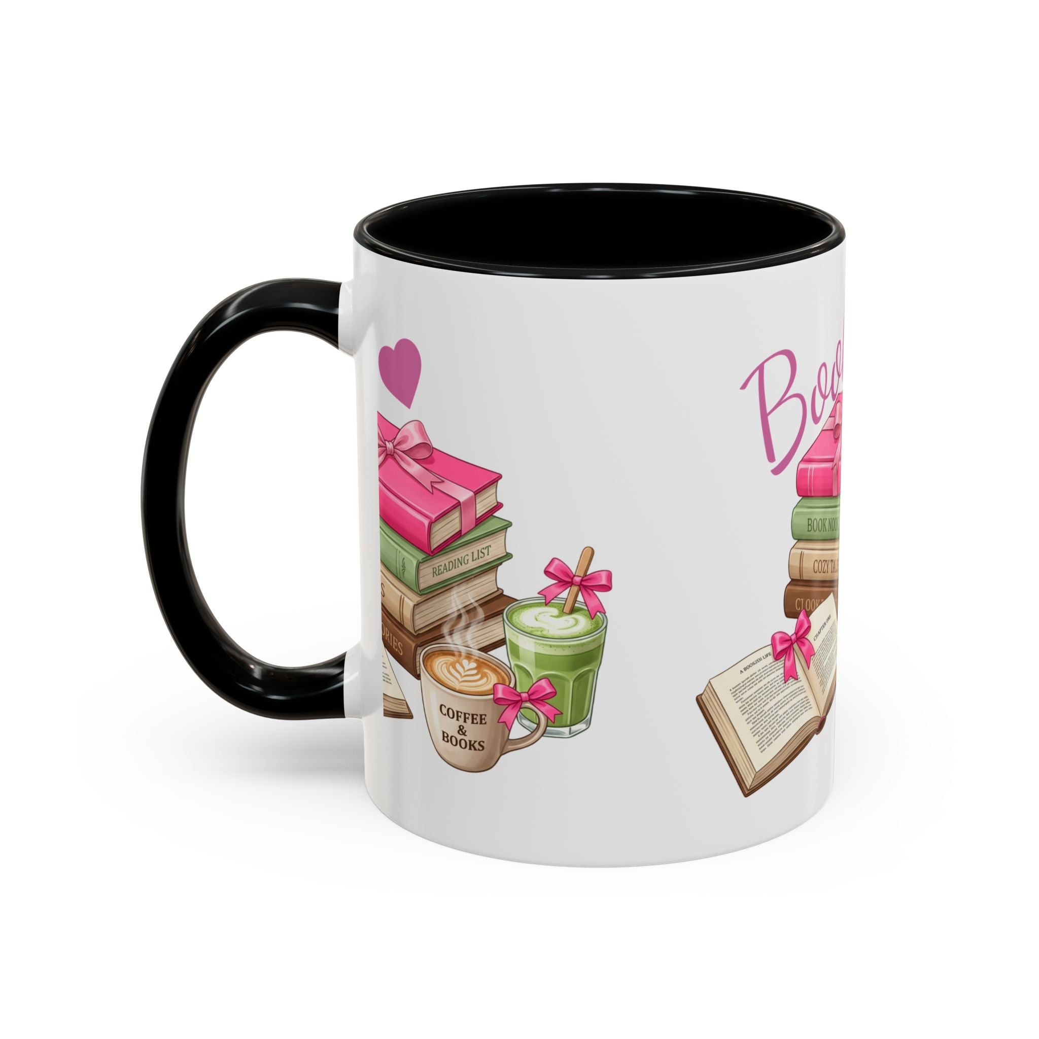 A white ceramic mug with a black handle and black interior, decorated with a colorful illustration of books, coffee cups, and pink macarons with the word 'Books' printed on the side.