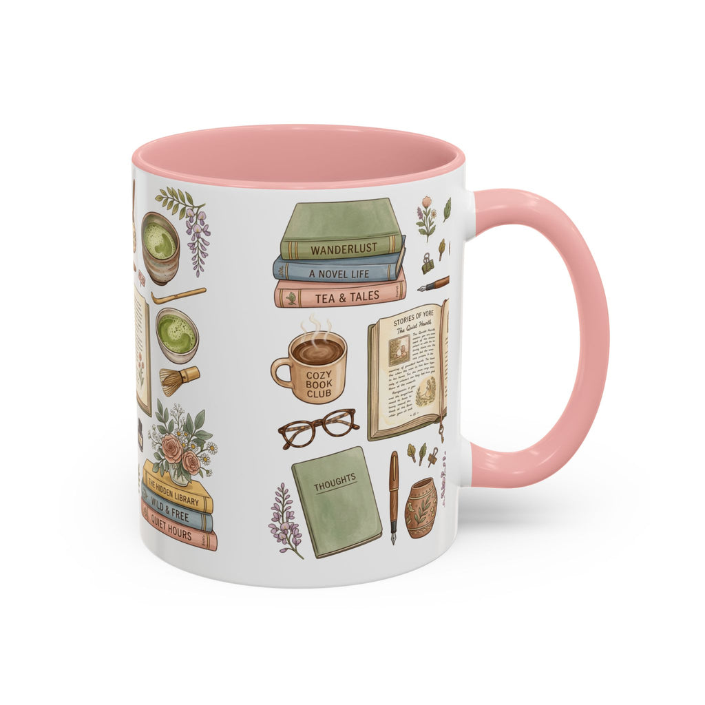 A white ceramic mug with a pink interior and handle, decorated with vintage-style illustrations of books, a cup of tea, glasses, flowers, and notebooks.