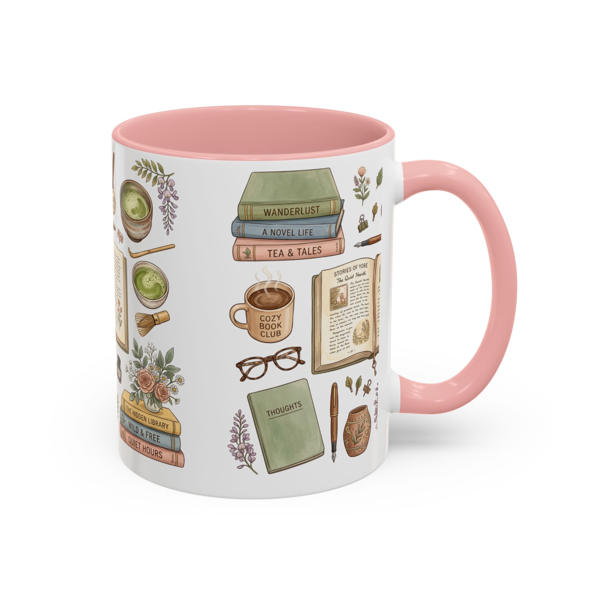 A white ceramic mug with a pink interior and handle, decorated with vintage-style illustrations of books, a cup of tea, glasses, flowers, and notebooks.