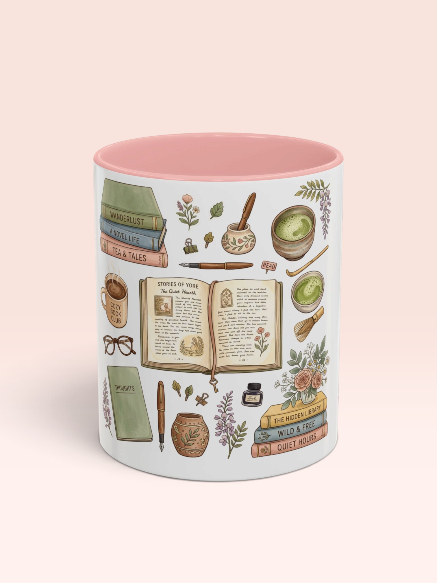 A white ceramic mug with a pink interior, decorated with a vintage-style illustrated pattern of books, an open manuscript, inkwell, herbs, and brewing ingredients, set against a solid pale pink background.